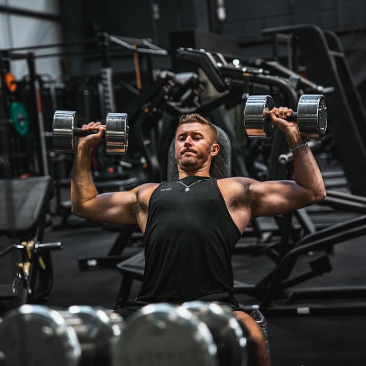 Interior of a professional gym with weight training equipment and mirrors
